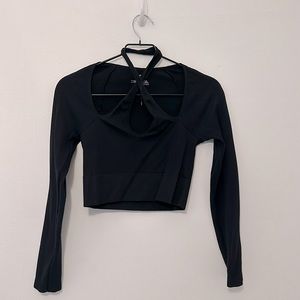 Versatile cropped black top. Can pair with anything from sweat pants to skirts